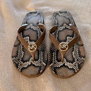 Michael Kors brown & gold with snakeskin print flip flops. Size 9